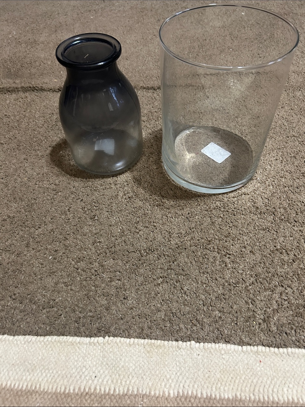 1 Smoky Gray Glass Vase and 1 clear glass vase.